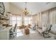 Bright home office featuring large windows, vaulted ceiling, and comfortable seating at 3601 Rosedown Dr, Matthews, NC 28105