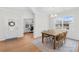 Formal dining room featuring wainscoting, a chandelier, and large windows at 367 Kennerly Center Dr, Mooresville, NC 28115