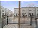 View from a private balcony overlooking a quiet street lined with modern townhomes at 3750 Ellington St, Charlotte, NC 28211