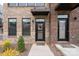 Inviting entryway featuring a black front door, modern awning, and well-manicured landscaping at 3750 Ellington St, Charlotte, NC 28211