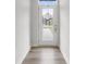 Bright entryway with luxury vinyl plank flooring leading to a glass-paneled front door at 3750 Ellington St, Charlotte, NC 28211