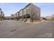 Street view showcasing modern townhomes with garages and balconies in a well-maintained community at 3750 Ellington St, Charlotte, NC 28211