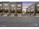 Modern townhomes at dusk featuring attached garages and balconies, set along a paved street at 3750 Ellington St, Charlotte, NC 28211