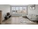 Bright living room featuring large windows, modern decor, and hardwood floors at 3750 Ellington St, Charlotte, NC 28211