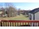 Wide backyard view from deck showcasing the lawn and surrounding landscape at 410 Cole Campbell Rd, Taylorsville, NC 28681