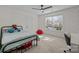 Bright bedroom featuring a metal frame bed, large window, ceiling fan, and neutral carpeting at 4119 Flint Dr, Lancaster, SC 29720