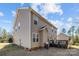 Tan two-story home featuring a wood deck perfect for outdoor dining and entertaining at 4119 Flint Dr, Lancaster, SC 29720