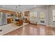 A kitchen with a large island, wooden cabinets, stainless steel appliances, and a door leading to an outdoor area at 4119 Flint Dr, Lancaster, SC 29720