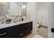 Elegant bathroom with marble countertop, modern fixtures, and adjacent shower at 412 Bertonley Ave, Charlotte, NC 28211