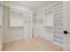 Bright walk-in closet with custom shelving and ample storage space at 412 Bertonley Ave, Charlotte, NC 28211