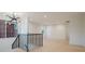 Open second-floor landing with modern chandelier, hardwood floors, and natural light at 412 Bertonley Ave, Charlotte, NC 28211