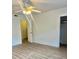 Bright bedroom featuring neutral walls, wood-look floors, and a ceiling fan at 4520 Central Ave # C, Charlotte, NC 28205