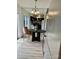 Bright dining area with a round table, chair, mirrored wall, and view into the kitchen at 4520 Central Ave # C, Charlotte, NC 28205