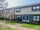 Townhome exterior showcases well-maintained landscaping, brick facade, and inviting front doors at 4520 Central Ave # C, Charlotte, NC 28205