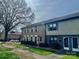 Townhome with brick and siding, showing well-maintained landscaping and inviting front entrances at 4520 Central Ave # C, Charlotte, NC 28205