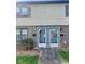 Inviting entry to the townhome with brick facade, modern door and manicured landscape at 4520 Central Ave # C, Charlotte, NC 28205