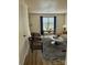 Bright living room featuring hardwood floors, modern furniture, and natural light from the large window at 4520 Central Ave # C, Charlotte, NC 28205