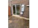 Home exterior featuring concrete patio and sliding glass doors at 4520 Central Ave # C, Charlotte, NC 28205