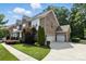 Beautiful brick home with a three-car garage and well-maintained landscaping, showing a spacious driveway at 4708 Pearmain Dr, Waxhaw, NC 28173