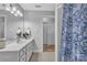 Bathroom with a tiled floor, a white vanity, a mirror, and a shower with a blue curtain at 49 Orchard Trace Ct, Taylorsville, NC 28681