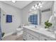 Bathroom featuring white walls, tiled floors, a vanity, a plant, and a mirror at 49 Orchard Trace Ct, Taylorsville, NC 28681