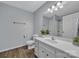 The bright bathroom features a single sink vanity, toilet, and a shower and tub combination at 49 Orchard Trace Ct, Taylorsville, NC 28681