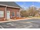 An exterior view displays a brick building with ample parking and an adjacent storage building at 49 Orchard Trace Ct, Taylorsville, NC 28681