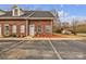 Charming brick townhome featuring front door and two parking spaces at 49 Orchard Trace Ct, Taylorsville, NC 28681