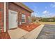 Charming brick home featuring a welcoming white front door and meticulous landscaping at 49 Orchard Trace Ct, Taylorsville, NC 28681