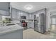 Modern kitchen featuring stainless steel appliances and light blue cabinets at 49 Orchard Trace Ct, Taylorsville, NC 28681