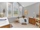 Well-lit bathroom boasts a corner soaking tub, large windows, and double sinks at 507 Saint Johns Dr, Salisbury, NC 28144