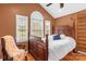 Bedroom boasts vaulted ceilings, large windows, and a wooden ladder leading to a loft space at 507 Saint Johns Dr, Salisbury, NC 28144