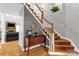 Inviting foyer with hardwood floors, staircase, and decorative table, showcasing the home's charm at 507 Saint Johns Dr, Salisbury, NC 28144