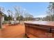 Backyard deck featuring a hot tub and outdoor seating, ideal for entertainment and relaxation at 507 Saint Johns Dr, Salisbury, NC 28144