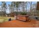 Inviting backyard deck featuring a relaxing hot tub, perfect for enjoying outdoor leisure at 507 Saint Johns Dr, Salisbury, NC 28144