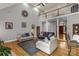 Open-concept living room with two-story ceilings, wood floors, stylish sofas, and natural light at 507 Saint Johns Dr, Salisbury, NC 28144