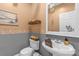 Charming powder room with decorative seashell accents, light fixtures, and vintage-inspired features at 507 Saint Johns Dr, Salisbury, NC 28144