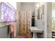 Simple bathroom with vintage tile, a window, and a shower with a butterfly curtain at 524 W Horah St, Salisbury, NC 28144