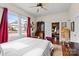 Bright bedroom with hardwood floors, vintage furniture, and ample natural light from large windows at 524 W Horah St, Salisbury, NC 28144