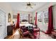 Cozy bedroom with hardwood floors, a decorative rug, and bright natural light from large windows at 524 W Horah St, Salisbury, NC 28144