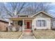 Inviting home with a red front door, covered porch, and attractive landscaping at 524 W Horah St, Salisbury, NC 28144