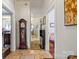 Bright hallway with hardwood floors, vintage furniture, and ample natural light from open rooms at 524 W Horah St, Salisbury, NC 28144