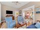 Comfortable living room with a classic design, featuring hardwood floors and a partial view into the kitchen at 524 W Horah St, Salisbury, NC 28144