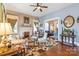 Spacious living room featuring hardwood floors, a fireplace, and natural light at 524 W Horah St, Salisbury, NC 28144