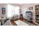 Comfortable living room with hardwood floors, a bookshelf, and large window at 524 W Horah St, Salisbury, NC 28144