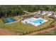 Aerial view showcasing a community pool, playground, tennis courts, and clubhouse at 529 Trading Post Ln, York, SC 29745