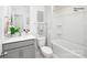 Cozy bathroom featuring a vanity sink, decorative mirror, toilet, bathtub, and stylish tile flooring at 531 Trading Post Ln, York, SC 29745