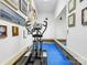 Exercise room with an elliptical machine, mirror, and motivational wall decor for fitness enthusiasts at 5501 Two Iron Dr, Matthews, NC 28104