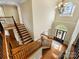 Grand foyer with beautiful hardwood floors, staircase, and a view of the front door at 5501 Two Iron Dr, Matthews, NC 28104