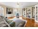 Spacious living room with built-in bookcases, modern furnishings, and bright, natural light at 5501 Two Iron Dr, Matthews, NC 28104